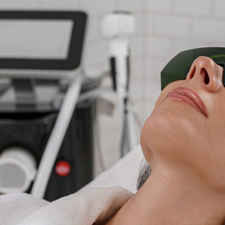 Woman is making cavitation rejuvenation skin treatment. Radio wave lifting